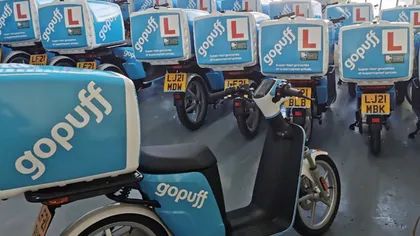 A depot full of Gopuff-liveried electric mopeds